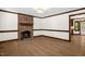 Living room featuring a brick fireplace, neutral paint, and hardwood floors at 616 Cross Timbers Dr, Durham, NC 27713