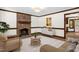 Bright living room with a brick fireplace, neutral decor, and hardwood floors at 616 Cross Timbers Dr, Durham, NC 27713