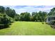 Spacious backyard with well-maintained lawn and plenty of mature trees at 6600 Sadie Dr, Wendell, NC 27591