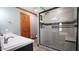 Updated bathroom with a glass enclosed shower, double sinks and modern finishes at 6600 Sadie Dr, Wendell, NC 27591