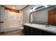 Bathroom with gray walls, double sink vanity, and shower/tub combo at 6600 Sadie Dr, Wendell, NC 27591