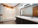Bathroom featuring a double sink vanity, shower/tub combo, and wood accents at 6600 Sadie Dr, Wendell, NC 27591