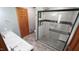 Bathroom with modern shower, sleek vanity with granite counters and updated fixtures at 6600 Sadie Dr, Wendell, NC 27591