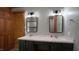 Updated bathroom with double sinks, wood trim and modern fixtures at 6600 Sadie Dr, Wendell, NC 27591