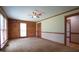 Bedroom features log walls, neutral carpet, overhead fan, and two windows for lots of natural light at 6600 Sadie Dr, Wendell, NC 27591