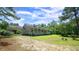 Charming home featuring a long porch, a convenient carport, and a beautifully landscaped yard at 6600 Sadie Dr, Wendell, NC 27591