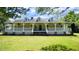 Charming home with a covered porch, dormer windows, and lush green lawn at 6600 Sadie Dr, Wendell, NC 27591