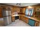 Kitchen featuring wooden cabinets, stainless steel appliances, and a sink at 6600 Sadie Dr, Wendell, NC 27591