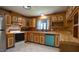 Open kitchen featuring wooden cabinets, modern appliances, and a sink under the window at 6600 Sadie Dr, Wendell, NC 27591