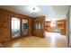 Open-concept living space connecting a cozy sitting area to the kitchen, featuring wood floors at 6600 Sadie Dr, Wendell, NC 27591