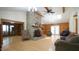 Bright living room with a stone fireplace, hardwood floors, and natural light at 6600 Sadie Dr, Wendell, NC 27591