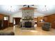Cozy living room with a stone fireplace, hardwood floors, and vaulted ceilings at 6600 Sadie Dr, Wendell, NC 27591