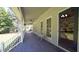 Charming covered front porch with ceiling fans, seating and views of yard at 6600 Sadie Dr, Wendell, NC 27591