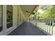 Inviting covered porch with ceiling fan and ample seating area at 6600 Sadie Dr, Wendell, NC 27591
