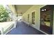 Long covered front porch featuring classic seating, a ceiling fan, and ample space for relaxation at 6600 Sadie Dr, Wendell, NC 27591