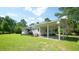 Rear exterior view showcasing the home's carport and screened in porch at 6600 Sadie Dr, Wendell, NC 27591