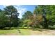 Lush, mature trees and grass in a beautiful, well-maintained yard create a tranquil and inviting outdoor space at 6600 Sadie Dr, Wendell, NC 27591