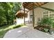 Backyard patio with second-story deck and door to basement at 6809 Middleboro Dr Dr, Raleigh, NC 27612
