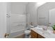 Bathroom featuring a tub-shower combo and wood vanity cabinet at 6809 Middleboro Dr Dr, Raleigh, NC 27612