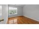 Bedroom featuring a window and hardwood floors at 6809 Middleboro Dr Dr, Raleigh, NC 27612