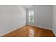 Bedroom featuring a window and hardwood floors at 6809 Middleboro Dr Dr, Raleigh, NC 27612