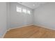 This bedroom features hardwood floors, neutral colors and ample natural light at 6809 Middleboro Dr Dr, Raleigh, NC 27612