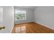 Bedroom featuring a window and hardwood floors at 6809 Middleboro Dr Dr, Raleigh, NC 27612