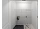 Walk-in closet with overhead wire shelving and utility hookups at 6809 Middleboro Dr Dr, Raleigh, NC 27612