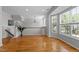 Bright living room with hardwood floors, large windows, and modern finishes at 6809 Middleboro Dr Dr, Raleigh, NC 27612