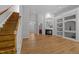 Bright living room features hardwood floors, fireplace, and custom built-in shelving at 6809 Middleboro Dr Dr, Raleigh, NC 27612