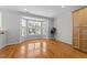 Sunlit living room with hardwood floors and large bay window at 6809 Middleboro Dr Dr, Raleigh, NC 27612