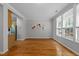 Open living room showcases hardwood floors, natural light, and neutral walls at 6809 Middleboro Dr Dr, Raleigh, NC 27612