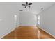 Spacious main bedroom featuring hardwood floors and neutral walls at 6809 Middleboro Dr Dr, Raleigh, NC 27612