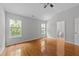 Spacious main bedroom with an ensuite bathroom, neutral walls, and hardwood floors at 6809 Middleboro Dr Dr, Raleigh, NC 27612