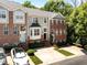 Charming townhouses feature brick facades, well-manicured landscaping, and inviting entrances at 6809 Middleboro Dr Dr, Raleigh, NC 27612