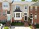 Charming townhouses feature brick facades, well-manicured landscaping, and inviting entrances at 6809 Middleboro Dr Dr, Raleigh, NC 27612