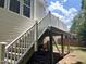 Exterior view of the deck showing the stairs and support structure of a backyard deck at 82 Finley Ct, Clayton, NC 27520