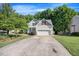 Inviting home with a two-car garage and lush green landscaping at 82 Finley Ct, Clayton, NC 27520