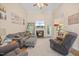 Cozy living room with high ceilings, fireplace, and comfortable seating at 82 Finley Ct, Clayton, NC 27520