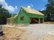 New home under construction with Zip System sheathing, wood framing, and gravel driveway at 8920 Thompson Mill Rd, Wake Forest, NC 27587