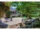 Inviting backyard patio and water feature offer a serene outdoor living space for relaxation and enjoyment at 9048 Chelsea Dr, Raleigh, NC 27603