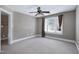 Bedroom featuring neutral walls, carpet, a ceiling fan, and a window with blinds at 9048 Chelsea Dr, Raleigh, NC 27603
