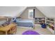 Childs bedroom with blue rug, a white trundle bed, and built-in white shelves for storage at 9048 Chelsea Dr, Raleigh, NC 27603