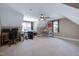 Large bonus room with vaulted ceilings, ceiling fan, natural light, and neutral decor at 9048 Chelsea Dr, Raleigh, NC 27603