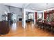 Open-concept with hardwood floors, the dining room features elegant lighting and decorative trim at 9048 Chelsea Dr, Raleigh, NC 27603
