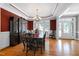 Elegant dining room featuring hardwood floors, decorative trim, and ample natural light at 9048 Chelsea Dr, Raleigh, NC 27603