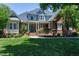 Beautiful two-story brick home with a well-maintained lawn and inviting front entrance at 9048 Chelsea Dr, Raleigh, NC 27603