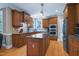 Gourmet kitchen with granite counters, stainless appliances, and large kitchen island at 9048 Chelsea Dr, Raleigh, NC 27603