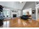 Bright living room with hardwood floors, fireplace, and views of the open kitchen at 9048 Chelsea Dr, Raleigh, NC 27603
