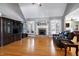 Spacious living room with hardwood floors, fireplace, and large windows for natural light at 9048 Chelsea Dr, Raleigh, NC 27603